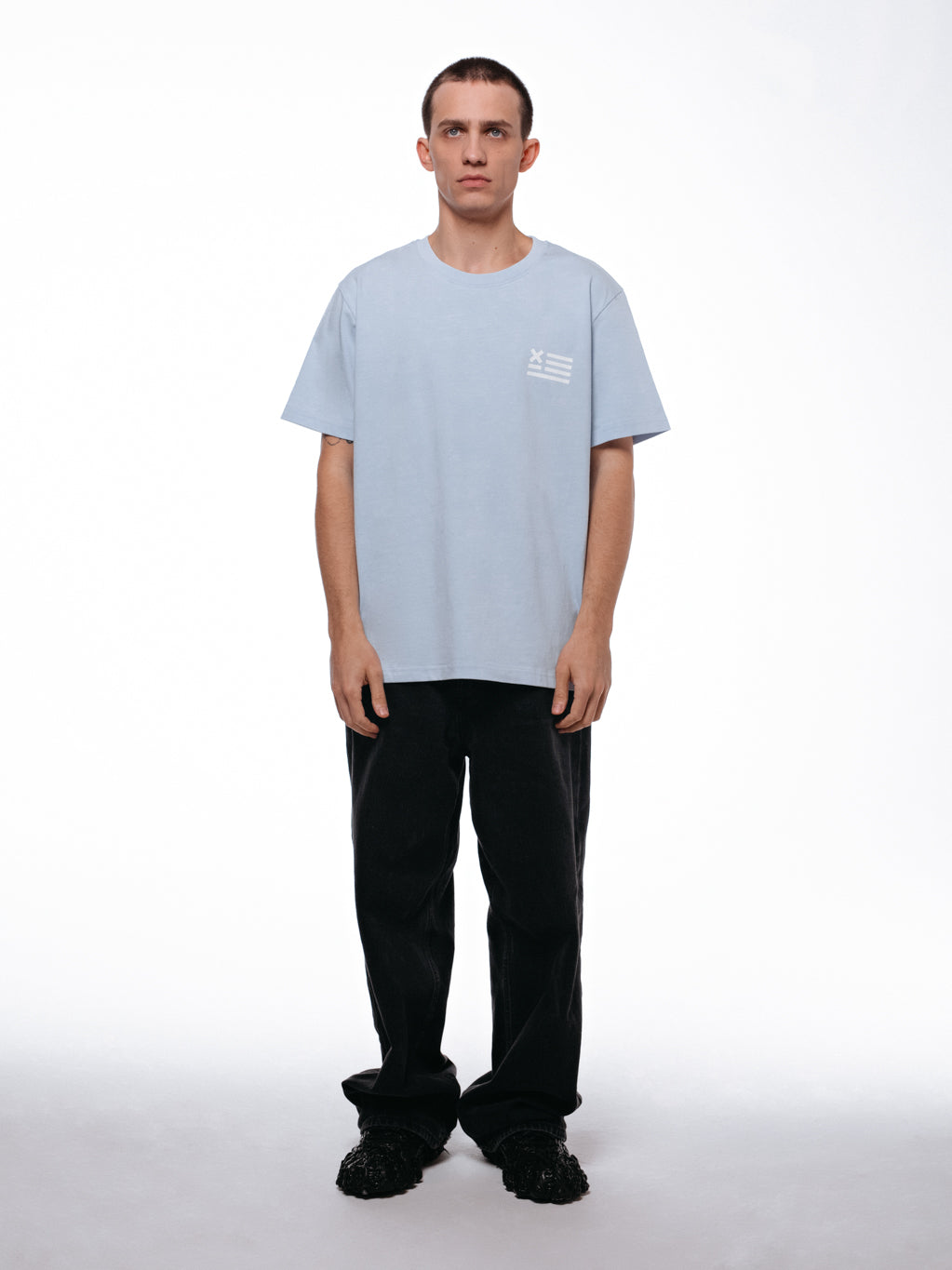 Front of the IX Nation t-shirt by 9INE viewed on a model.