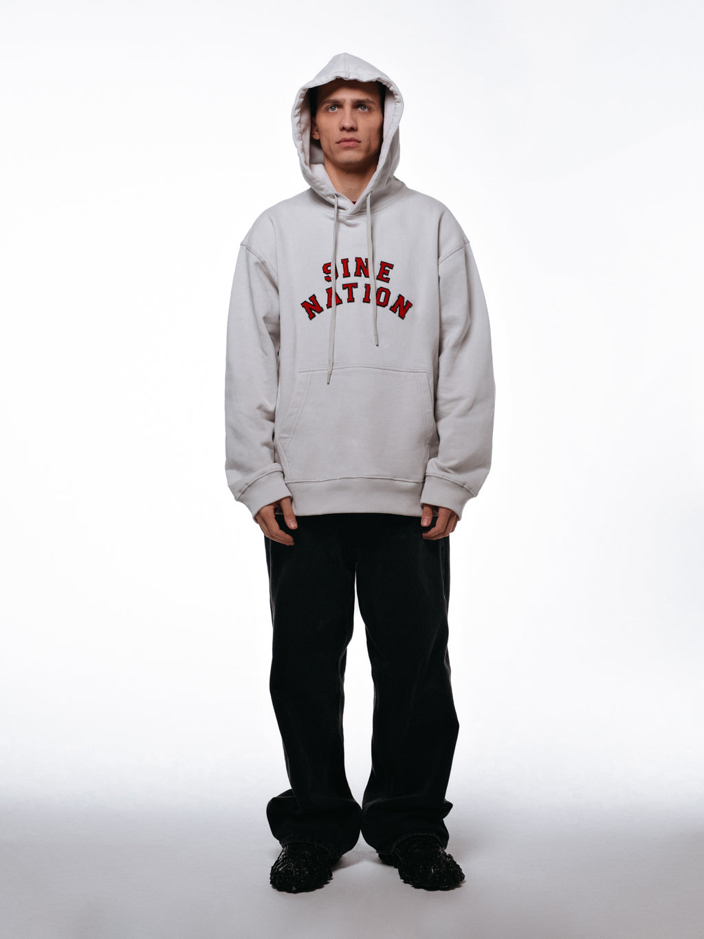 Front of the college hoodie viewed on a model.