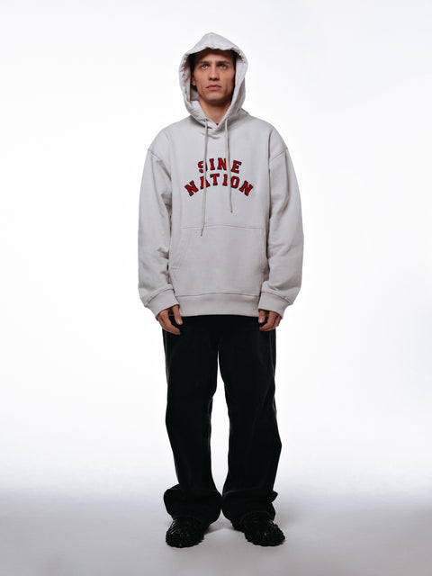 Front of the college hoodie viewed on a model.