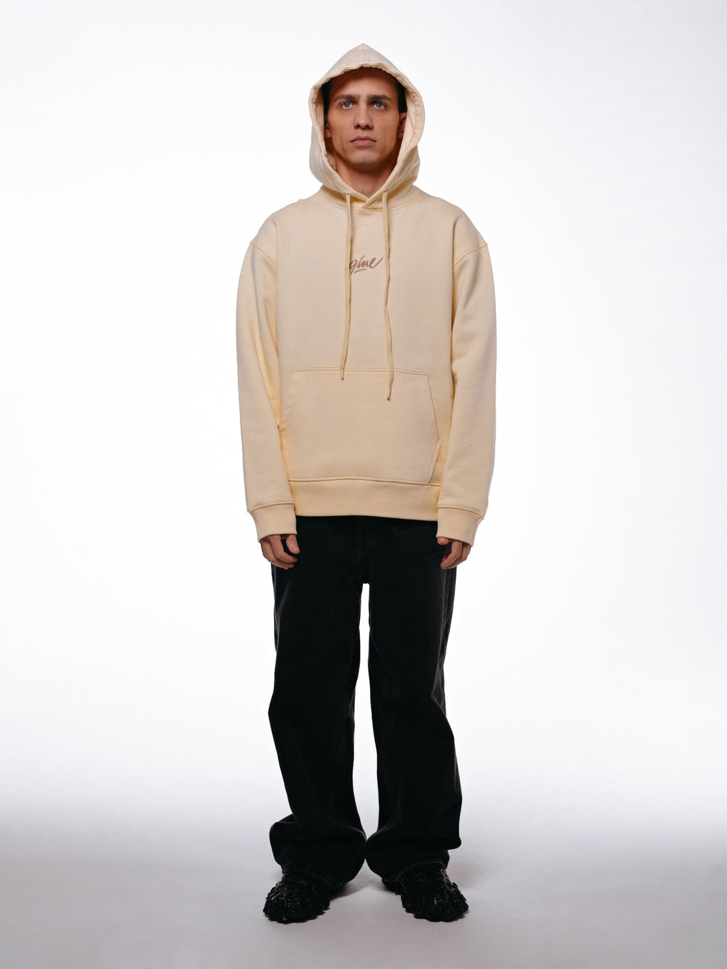 Front of the signature hoodie by 9INE viewed on a model.