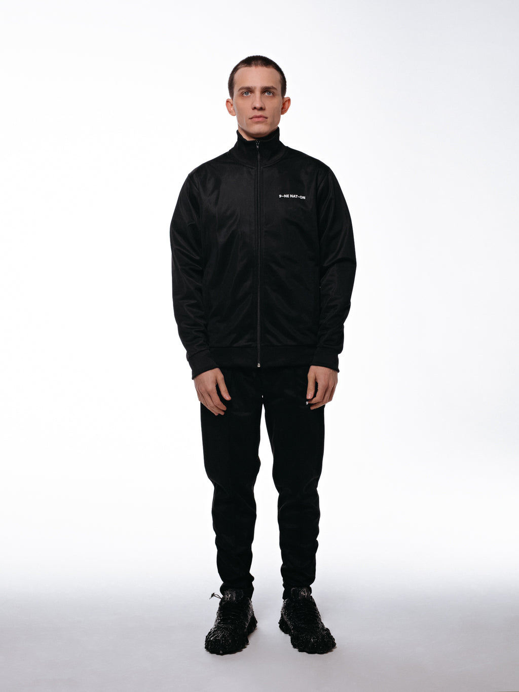 Front of the tracksuit by 9INE viewed on a model.